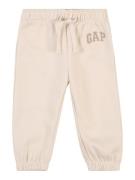 GAP Housut  beige / tummabeige