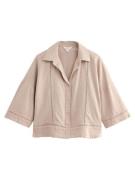 Next Pusero  beige