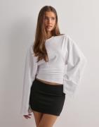 Nelly - Musta - Low Waist Mini Skirt
